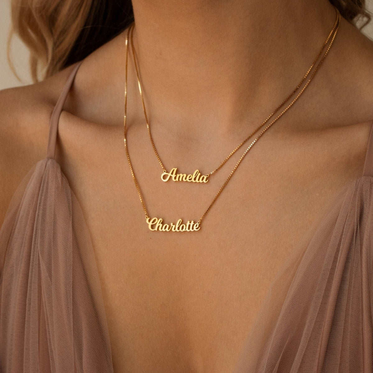 Custom double name necklace with silver chain and personalized engraved names, stylish jewelry by MUHVA STORE.