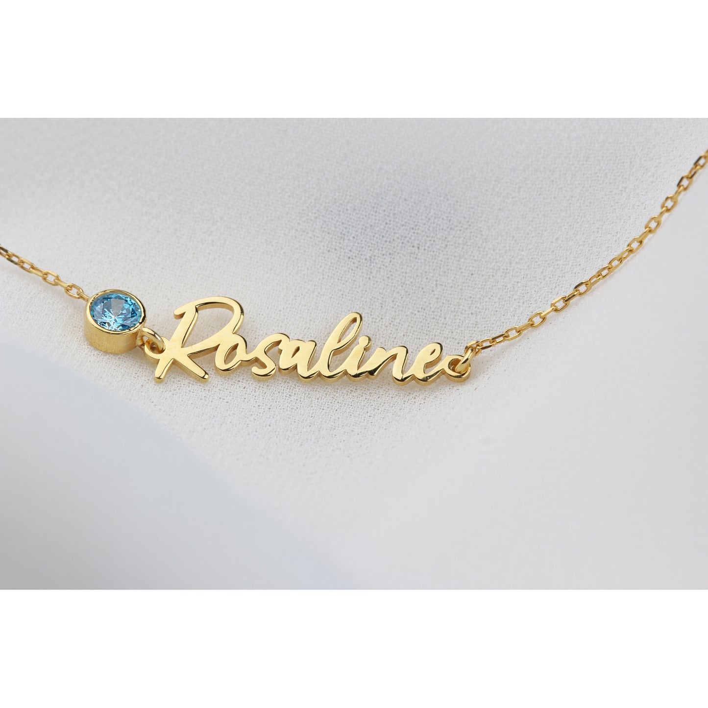 Birthstone name bracelet from MUHVA STORE featuring personalized engraved name and colorful birthstone charms.