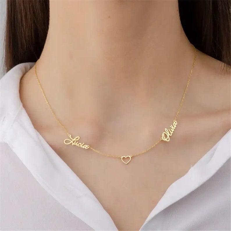 Personalized two-name necklace with heart charm, featuring custom text on a stylish jewelry chain by Muhva Store.