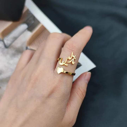 Arabic Heart Name Ring by MUHVA STORE featuring a personalized engraved heart-shaped design on a sleek silver band.