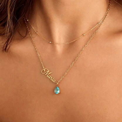 Personalized birthstone necklace with a silver chain and a customizable gemstone pendant, featuring the customer's birthstone.