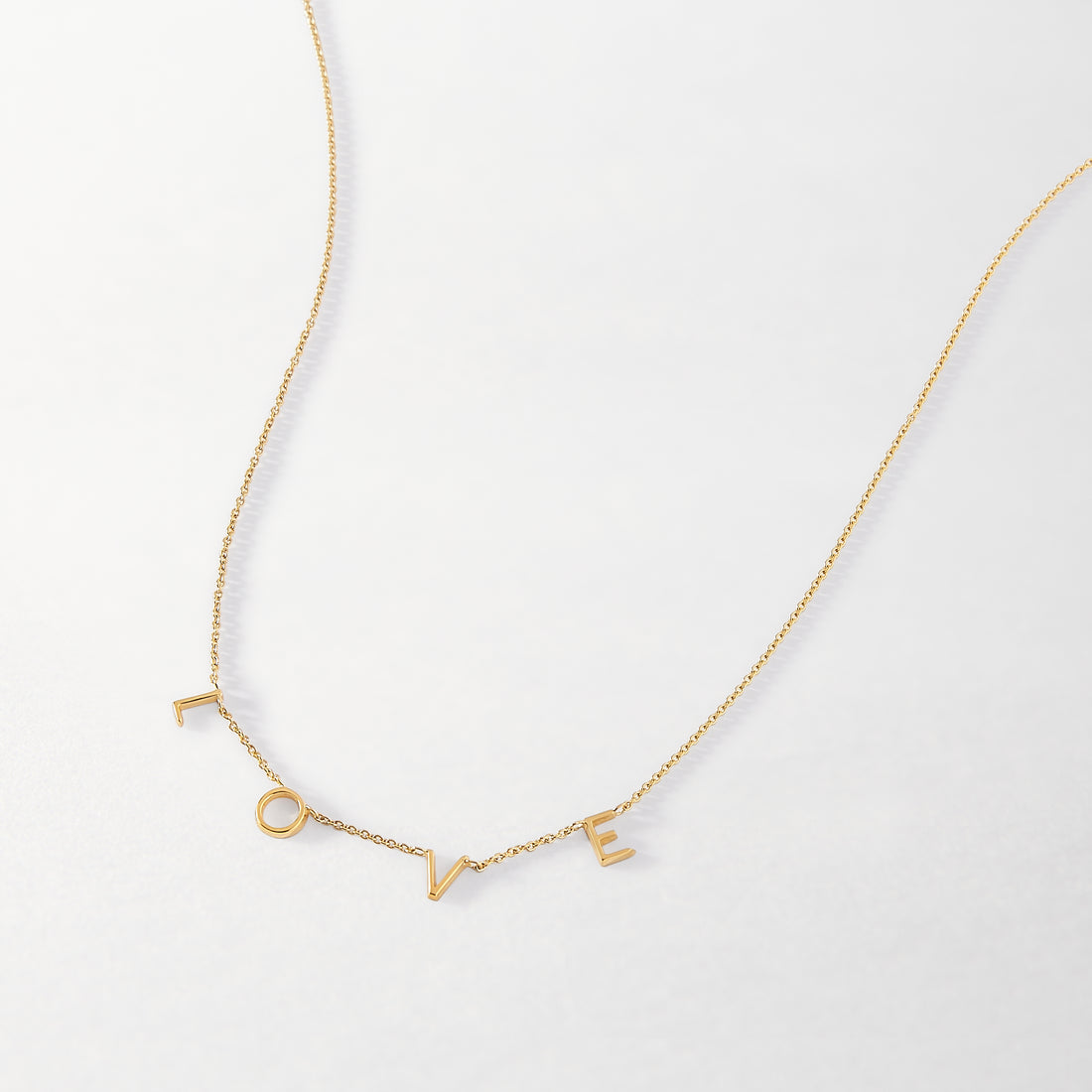 Personalized letter necklace from MUHVA STORE featuring a custom initial pendant on a delicate chain.