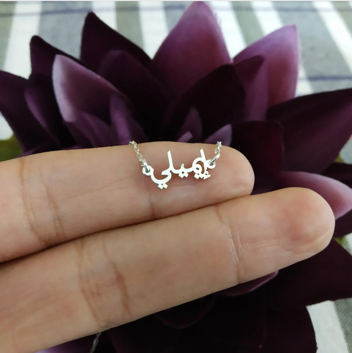 Tiny Arabic name necklace from MUHVA STORE featuring a delicate gold chain and personalized Arabic script pendant.