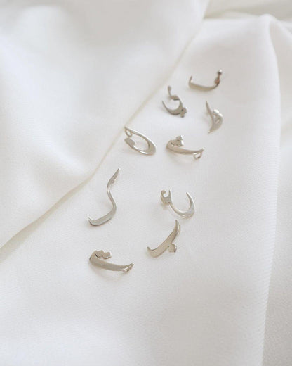 Arabic initial birthstone necklace with a gold chain and colorful gemstone pendant, elegant jewelry by MUHVA STORE