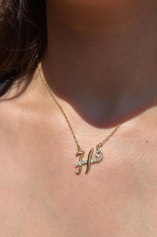 Custom duo initial necklace by MUHVA STORE with two personalized initial pendants on a delicate chain.