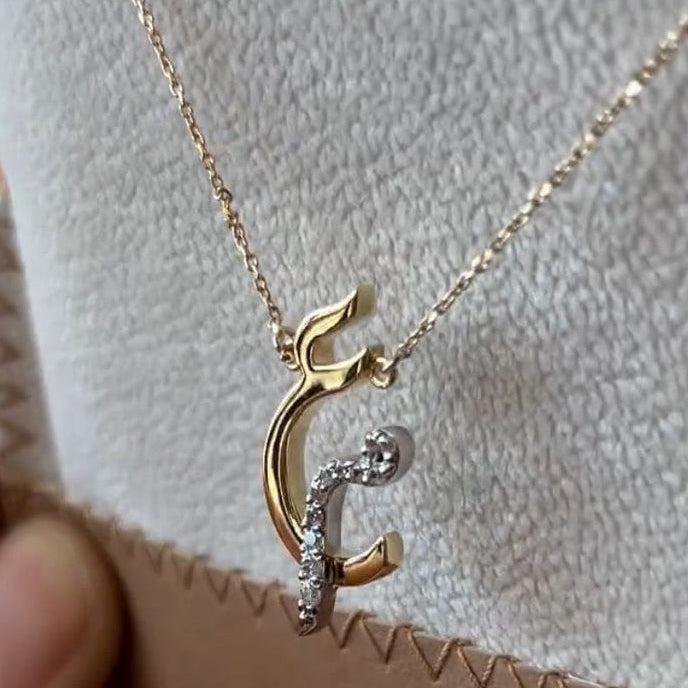 Diamond Arabic initial necklace with a gold chain, featuring a sparkling initial pendant, crafted by MUHVA STORE.