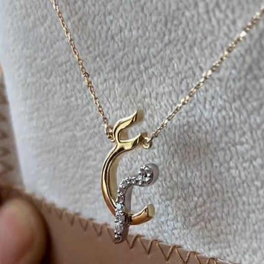 Diamond Arabic initial necklace with a gold chain, featuring a sparkling initial pendant, crafted by MUHVA STORE.