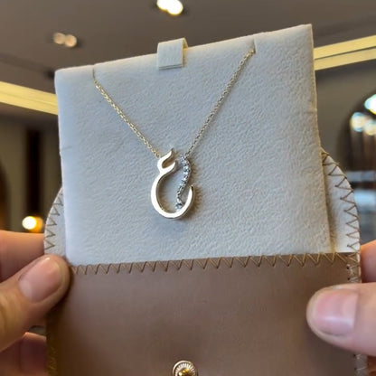 Gold Arabic initial necklace with diamond accents, featuring a delicate chain and personalized initial pendant from MUHVA STORE.