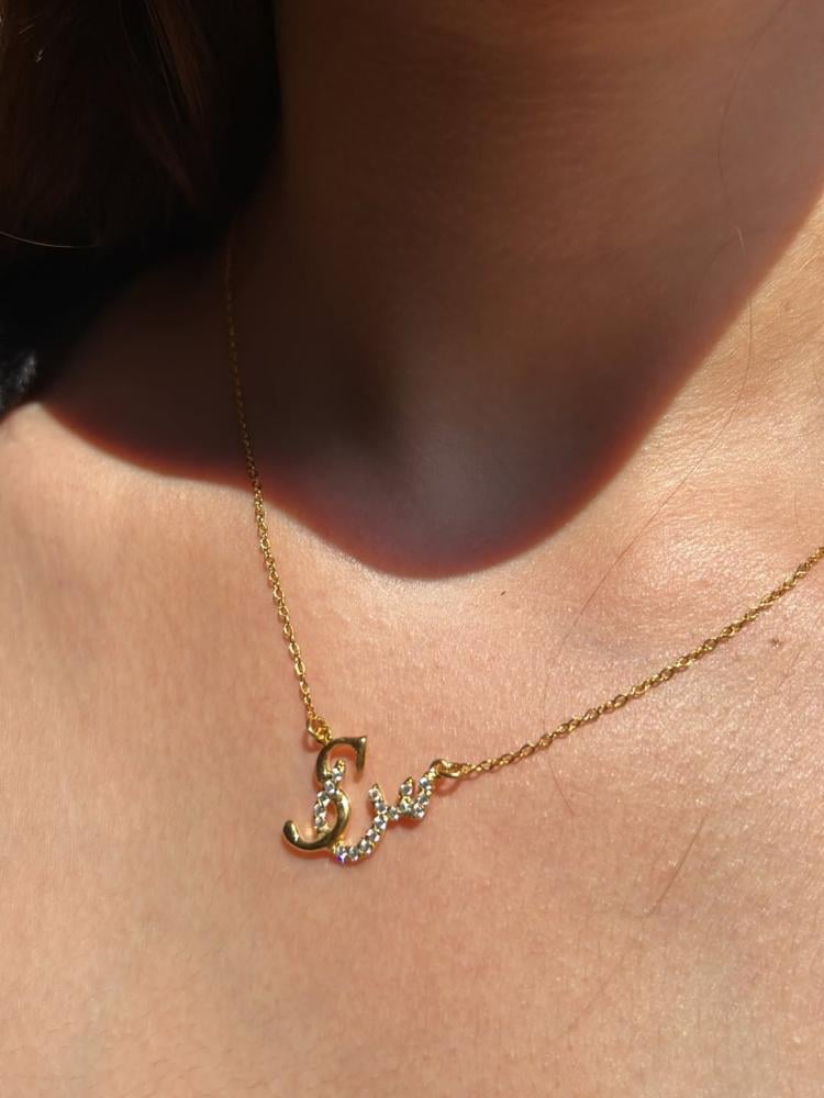 Custom duo initial necklace by MUHVA STORE featuring two personalized initial pendants on a delicate chain.
