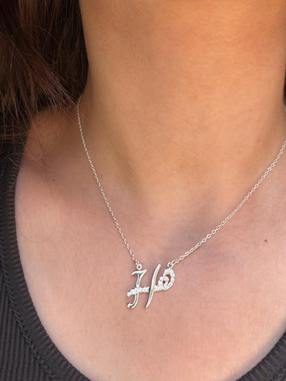 Custom duo initial necklace by MUHVA STORE featuring two engraved initial pendants on a delicate chain.