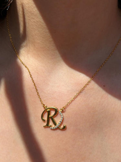 Custom duo initial necklace by MUHVA STORE featuring two personalized initial pendants on a delicate chain.