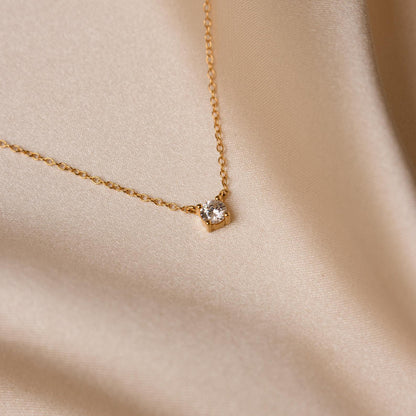 Dainty diamond pendant necklace from MUHVA STORE featuring a sparkling gemstone on a delicate chain.