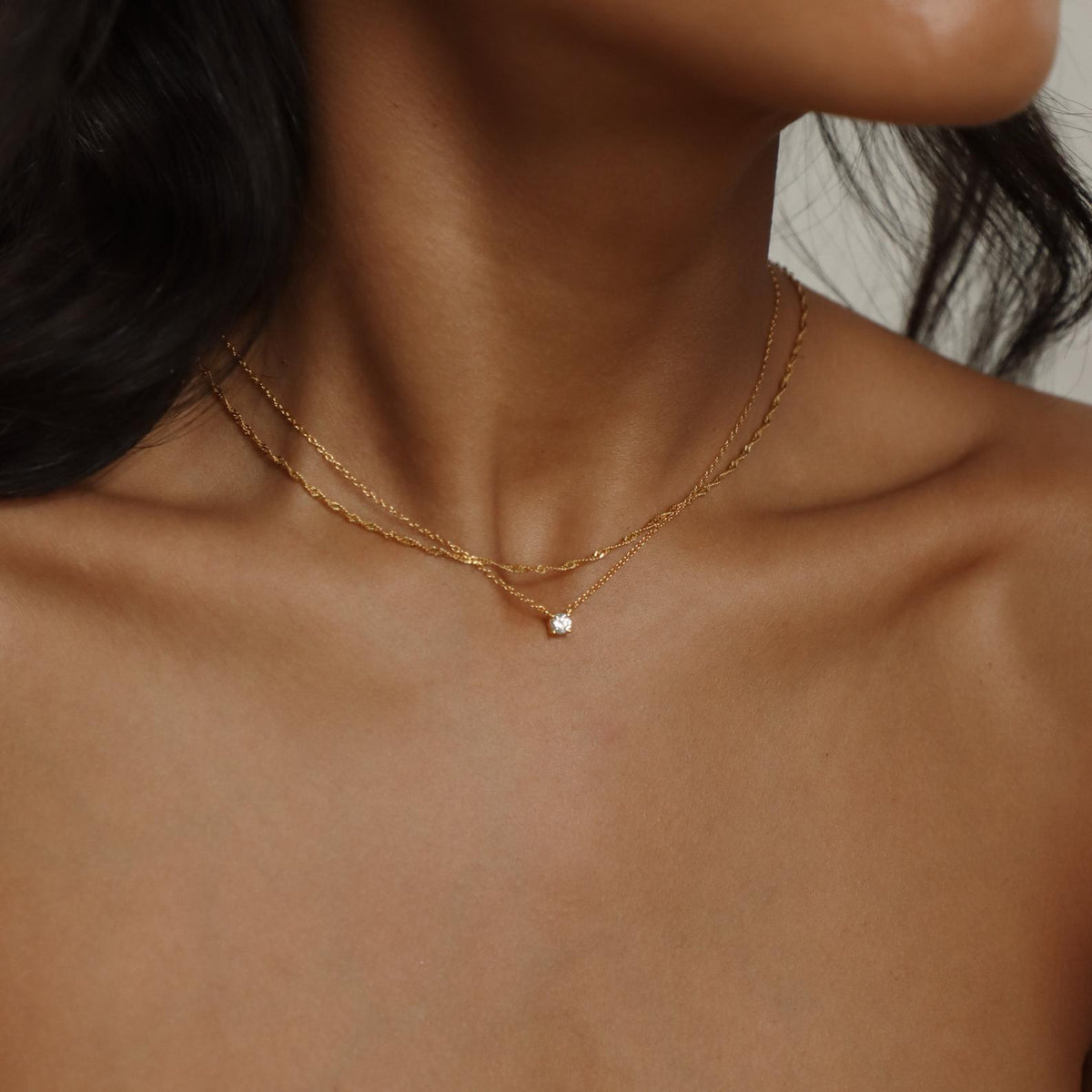 Dainty diamond pendant necklace from MUHVA STORE featuring a sparkling small diamond on a delicate chain.