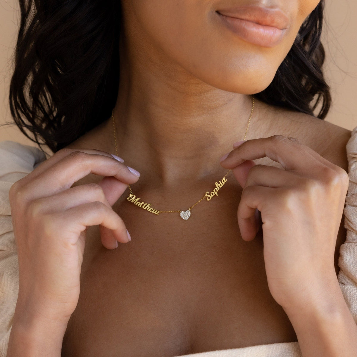 Personalized heart-shaped name necklace from MUHVA STORE with custom engraved name on a delicate silver chain.