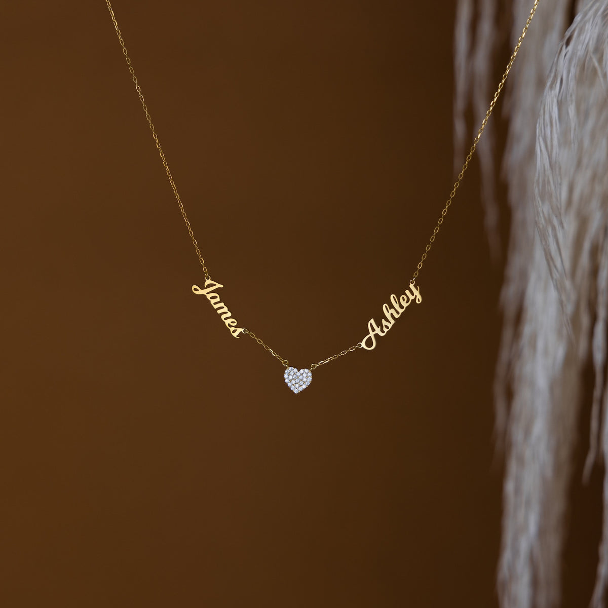 Personalized heart-shaped name necklace by MUHVA STORE featuring custom engraved text on a delicate chain.
