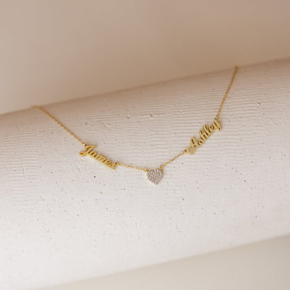 Personalized heart-shaped name necklace from MUHVA STORE, featuring custom engraved name on a delicate silver chain.