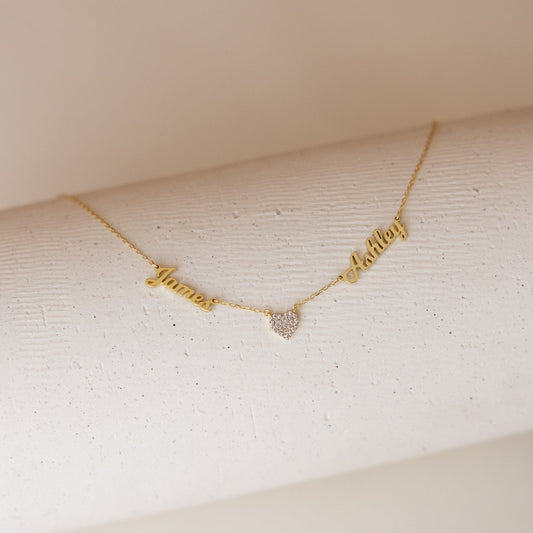 Personalized heart-shaped name necklace from MUHVA STORE, featuring custom engraved name on a delicate silver chain.