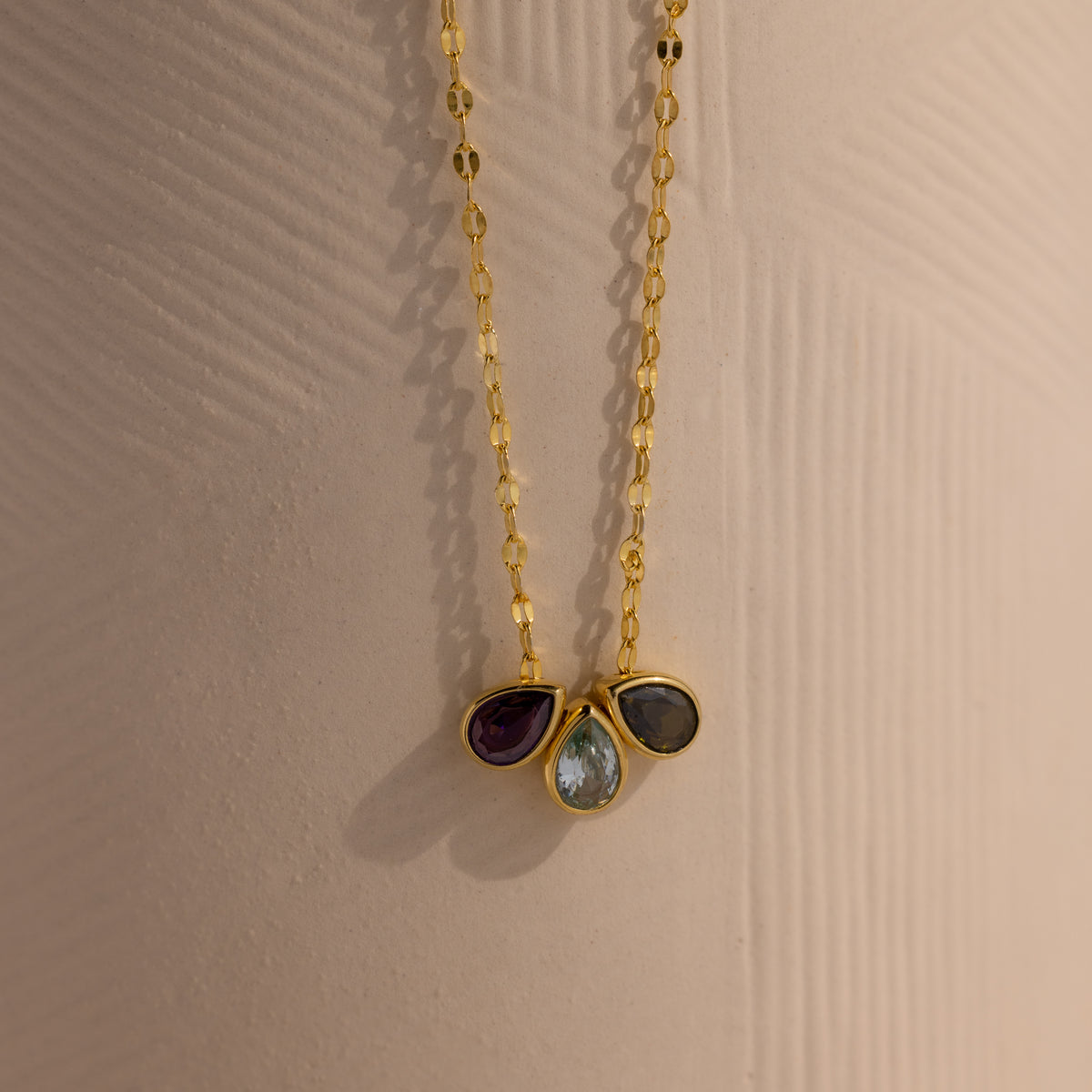 Teardrop birthstone name necklace from MUHVA STORE featuring a personalized pendant with a sparkling birthstone.
