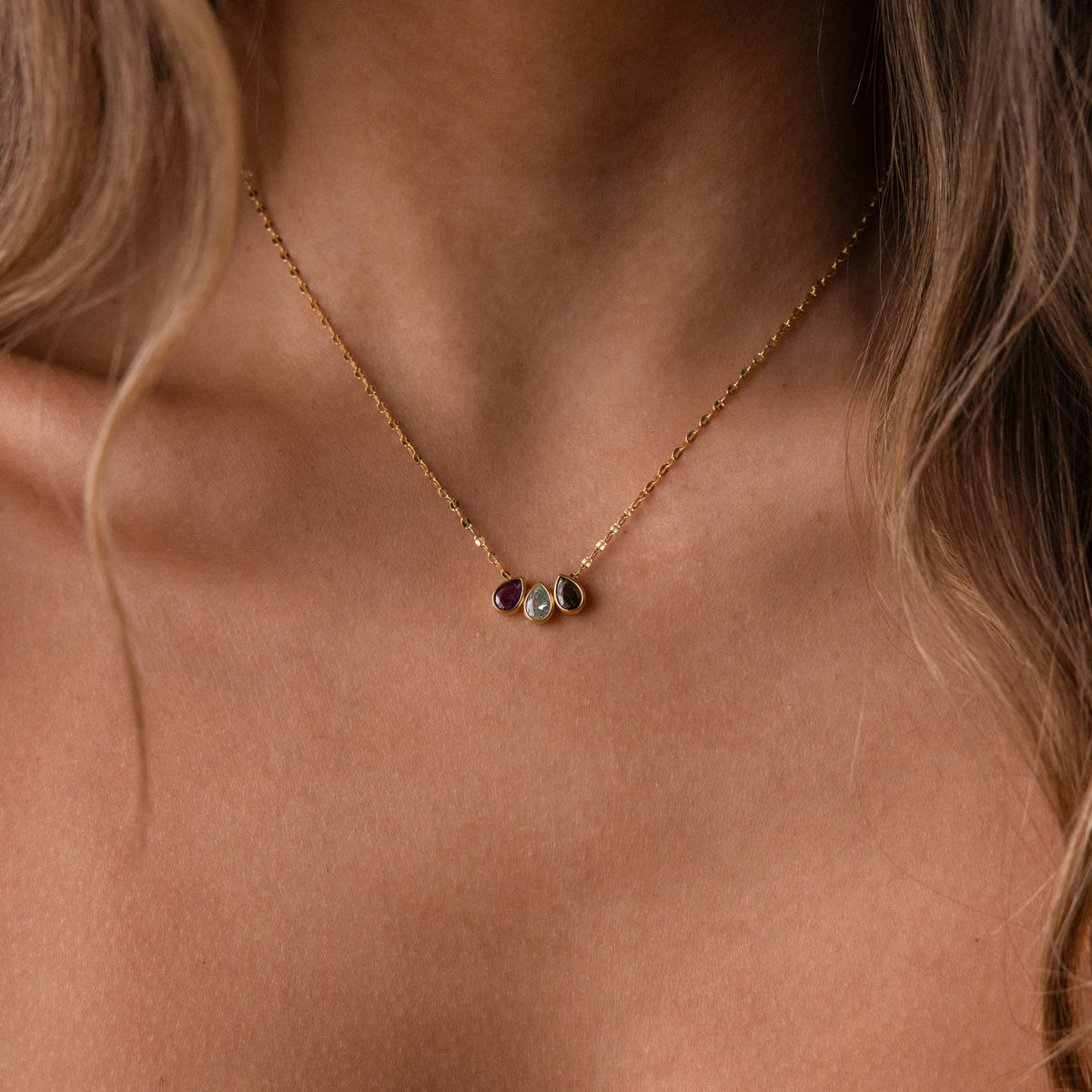 Teardrop birthstone name necklace by MUHVA STORE featuring a personalized pendant with a sparkling gemstone and delicate chain.
