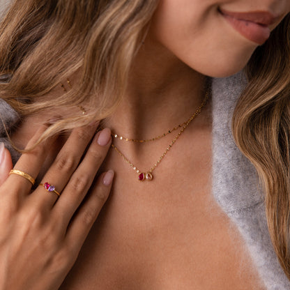 Teardrop-shaped birthstone name necklace by MUHVA STORE, showcasing personalized jewelry with a sparkling gemstone and delicate chain.