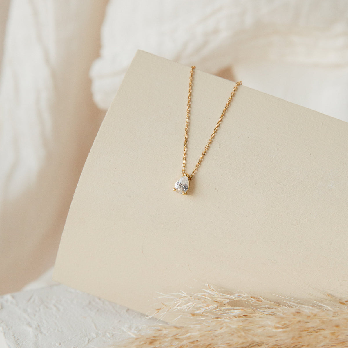 Rae Diamond Pendant Necklace by MUHVA STORE featuring a sparkling diamond pendant on a delicate silver chain.