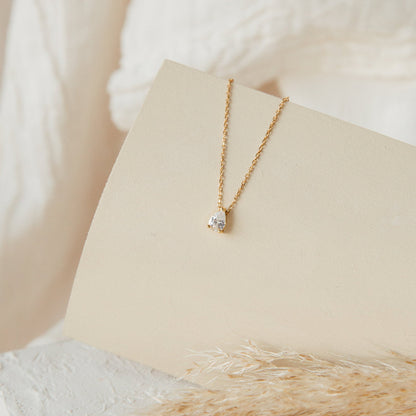 Rae Diamond Pendant Necklace by MUHVA STORE featuring a sparkling diamond pendant on a delicate silver chain.