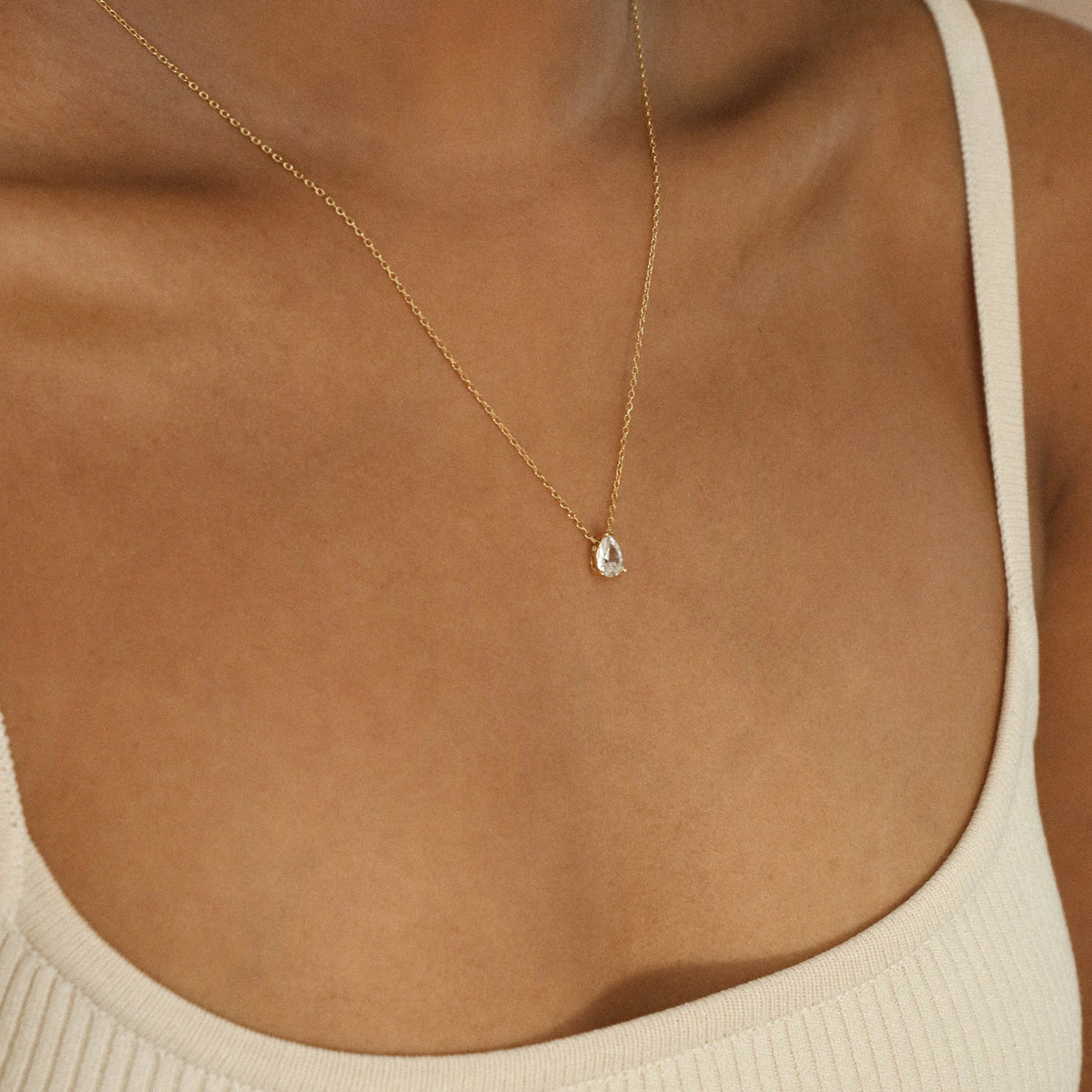 Rae Diamond Pendant Necklace by MUHVA STORE featuring a sparkling diamond pendant on a delicate chain.