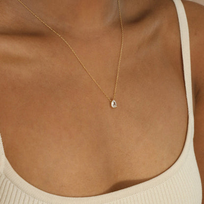 Rae Diamond Pendant Necklace by MUHVA STORE featuring a sparkling diamond pendant on a delicate chain.