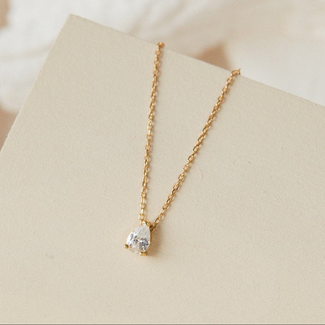 Rae Diamond Pendant Necklace by MUHVA STORE featuring a sparkling diamond pendant on a delicate chain.