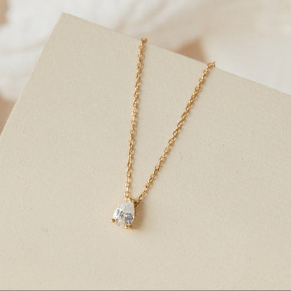 Rae Diamond Pendant Necklace by MUHVA STORE featuring a sparkling diamond pendant on a delicate chain.