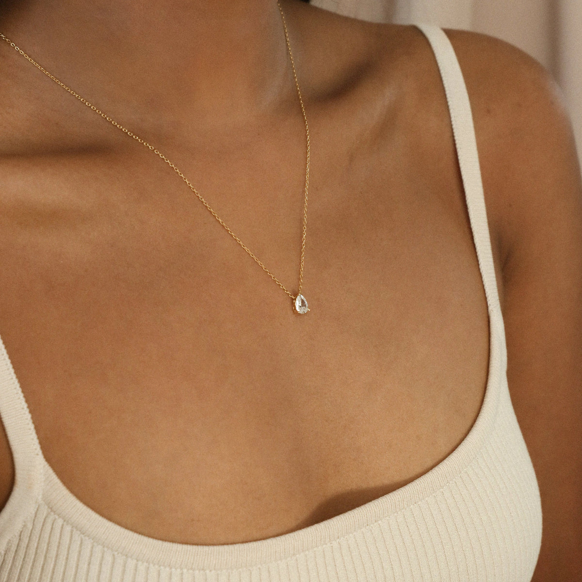 Rae Diamond Pendant Necklace by MUHVA STORE featuring a sparkling diamond pendant on a delicate chain.