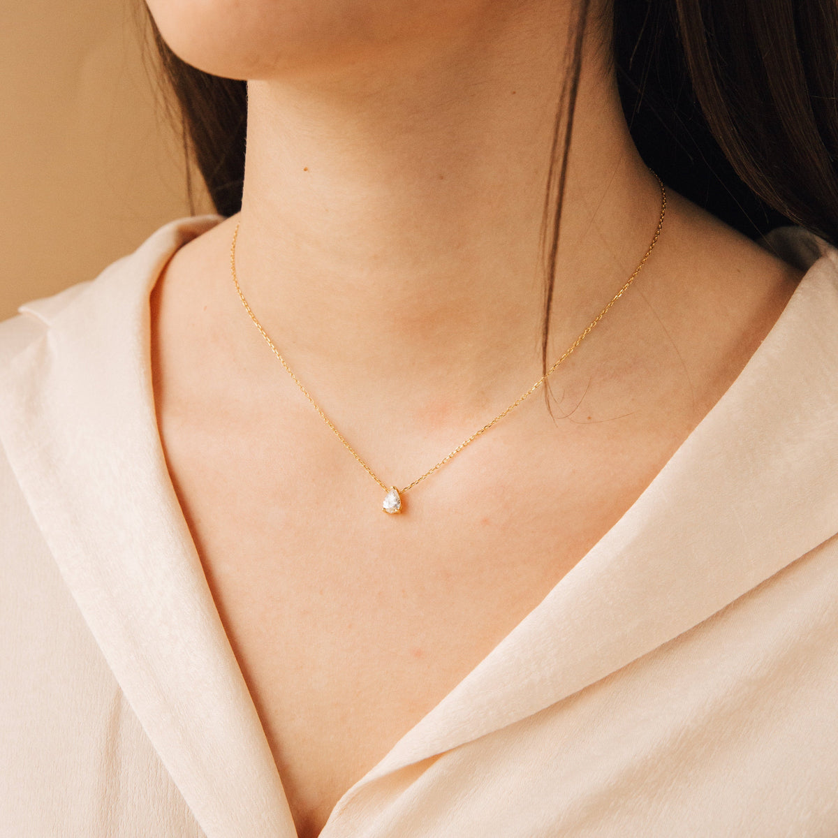 Shiny Rae Diamond Pendant Necklace by MUHVA STORE featuring a sparkling diamond pendant on a delicate chain.