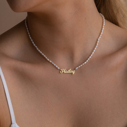 Personalized pearl name necklace with elegant chain and custom name pendant, crafted by MUHVA STORE.