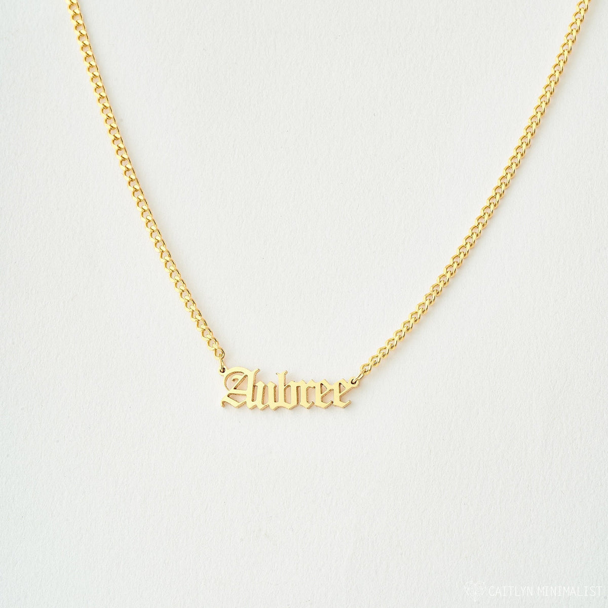 Gold Old English Name Necklace with custom engraved name on a delicate chain, crafted by MUHVA STORE.