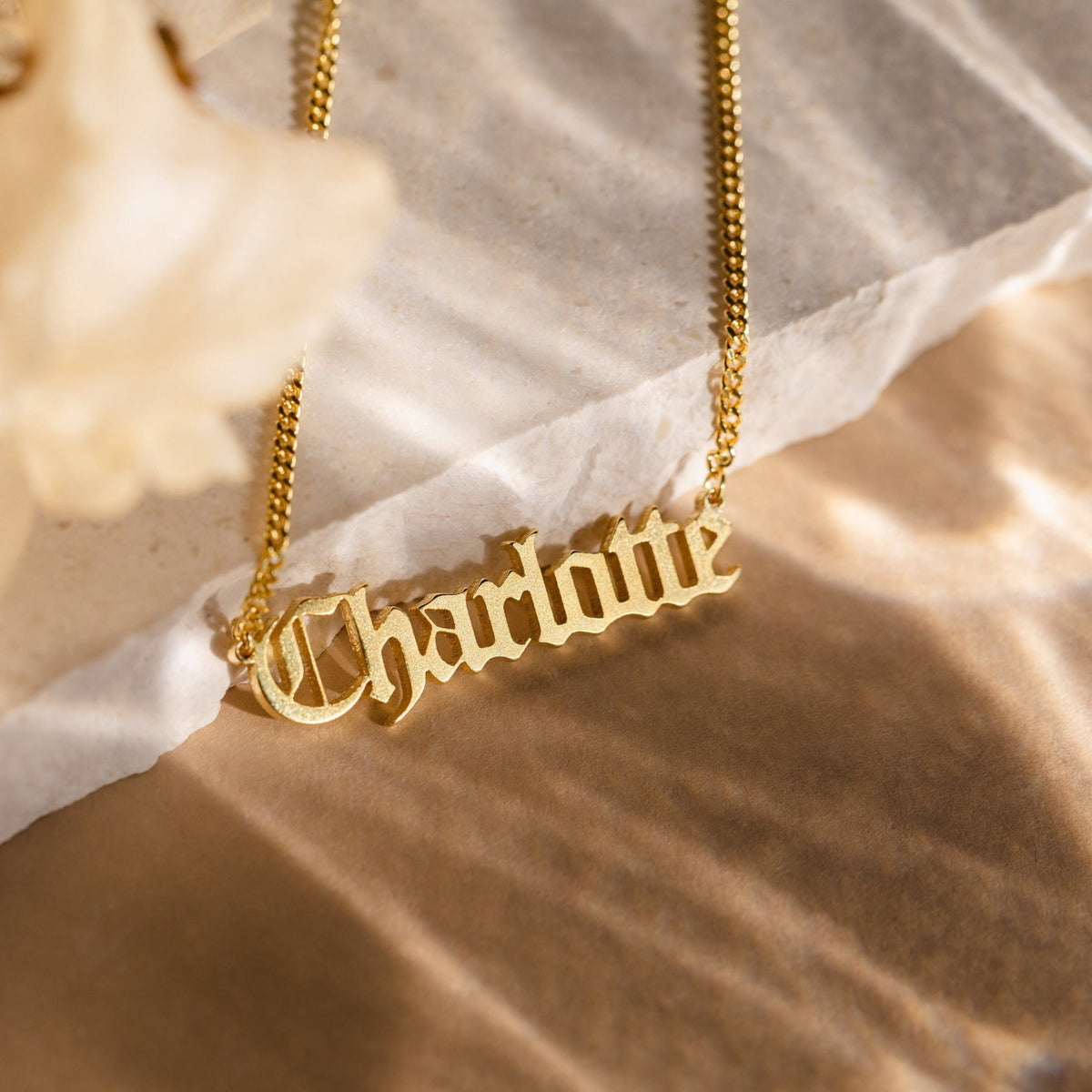 Old English Name Necklace by MUHVA STORE featuring a personalized gold-tone pendant with intricate Old English lettering.