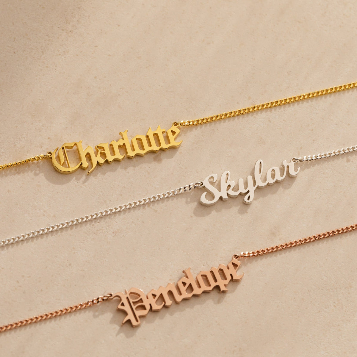 Old English name necklace by MUHVA STORE featuring a personalized engraved name in intricate Old English font on a silver chain.