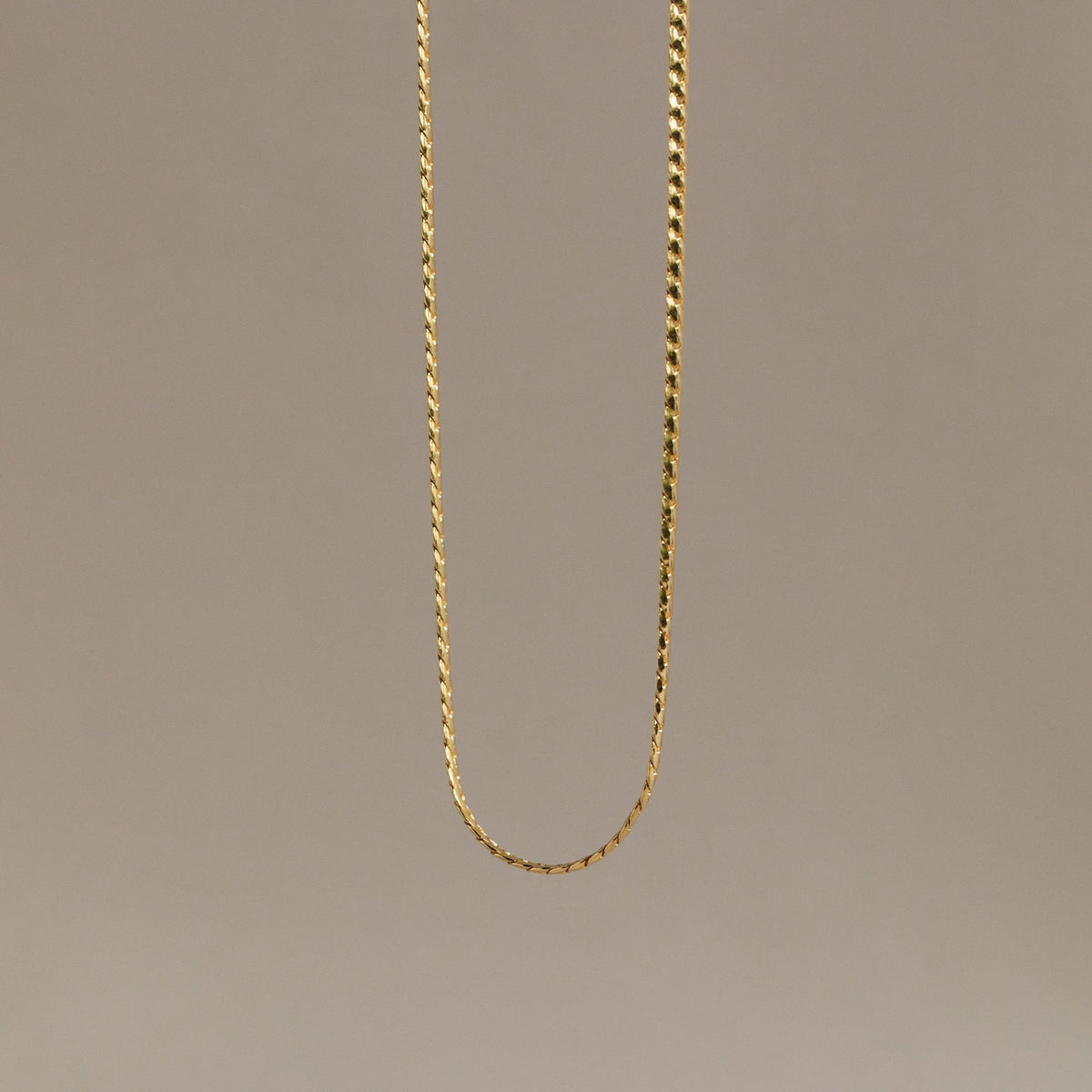 Men's snake chain necklace from MUHVA STORE featuring a sleek, silver-toned design with a smooth, flexible style.