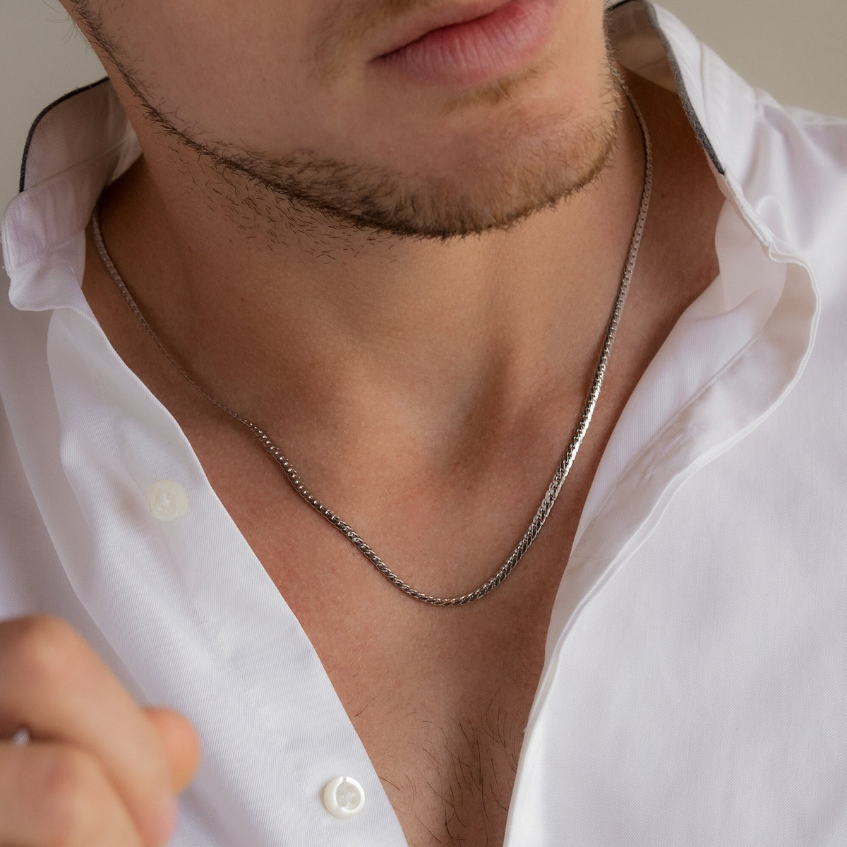 Men's snake chain necklace by MUHVA STORE, featuring a sleek silver design and smooth, intertwined links.