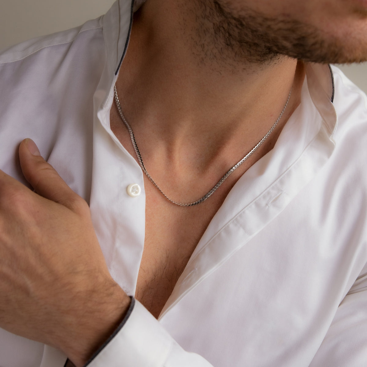 Men's snake chain necklace with a polished silver finish, featuring a smooth, flexible design from MUHVA STORE.