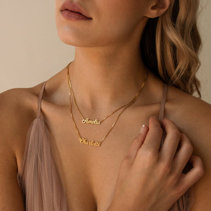 Custom double name necklace by MUHVA STORE featuring two personalized name pendants on a delicate chain.
