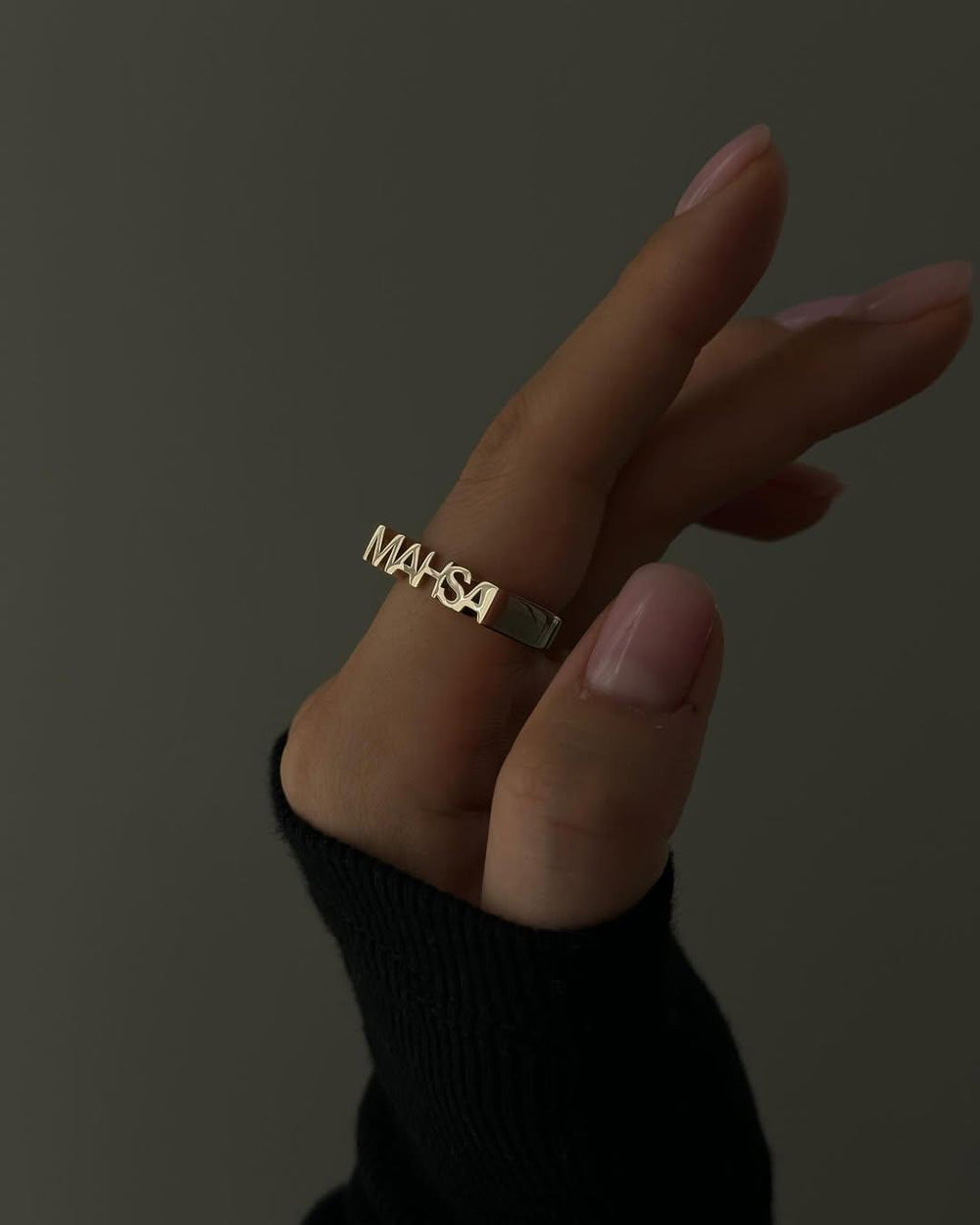 Personalized luxe name ring from MUHVA STORE featuring custom engraved name on a sleek gold band.