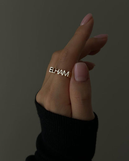 Personalized luxe name ring from MUHVA STORE featuring a sleek band with custom engraved name design