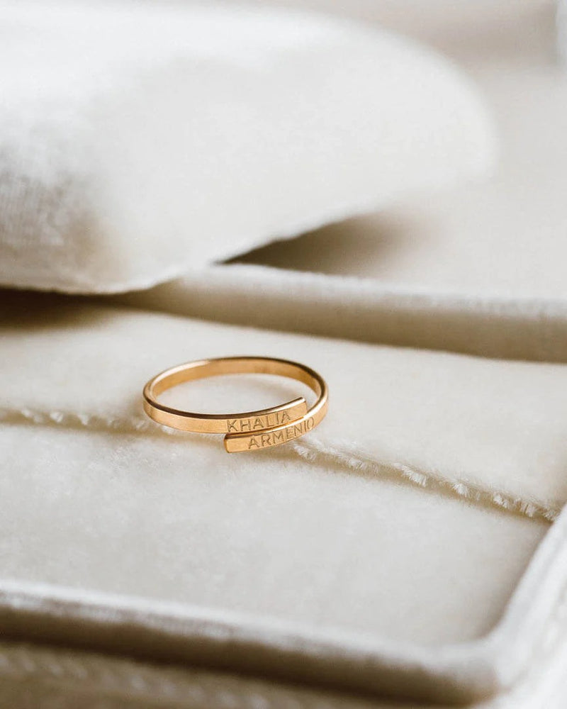 Memory Wrap Ring by MUHVA STORE featuring a sleek band with intricate wrap design and elegant metallic finish.
