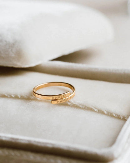 Memory Wrap Ring by MUHVA STORE featuring a sleek band with intricate wrap design and elegant metallic finish.