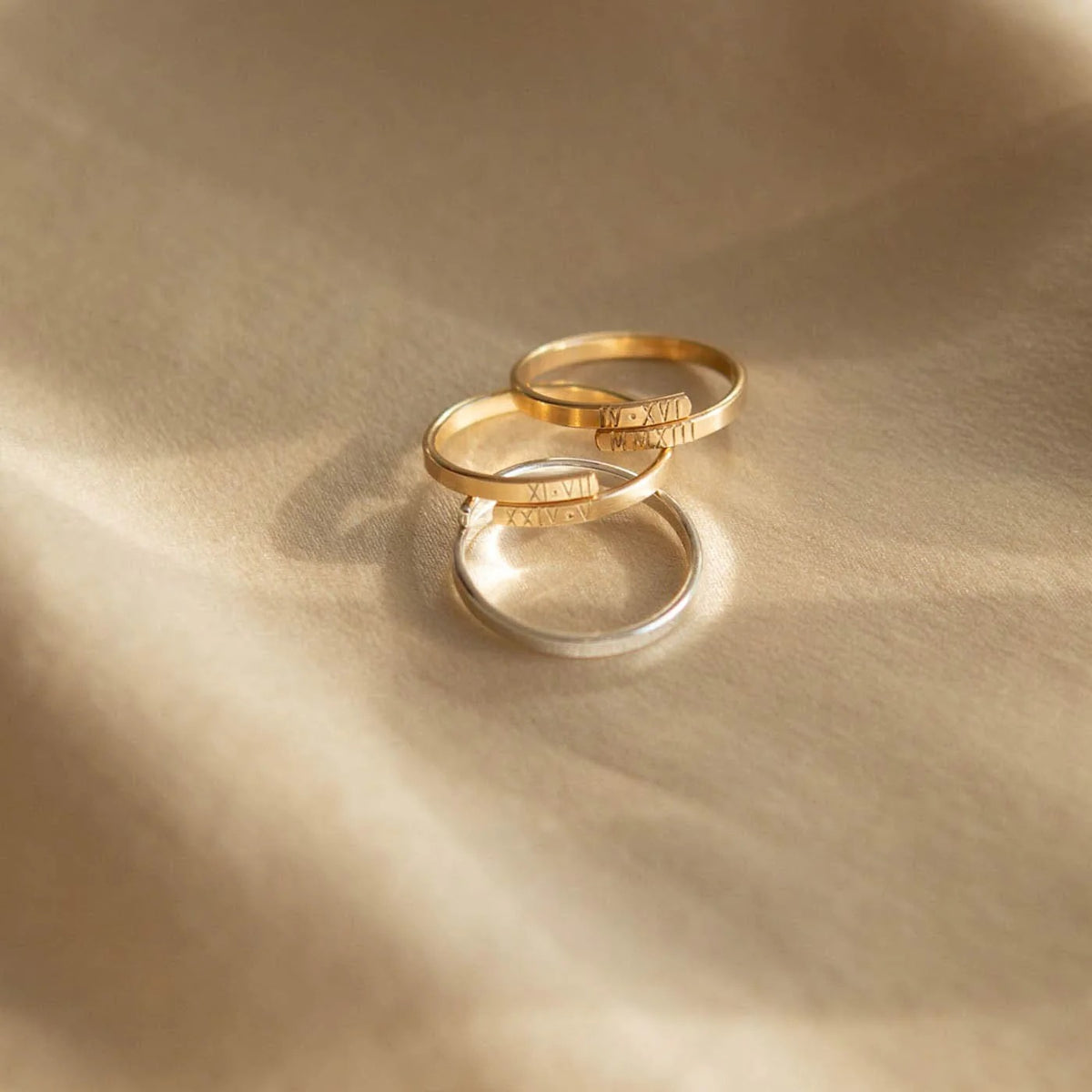 Memory Wrap Ring by MUHVA STORE featuring a sleek silver band with intricate wrap-around design and polished finish.