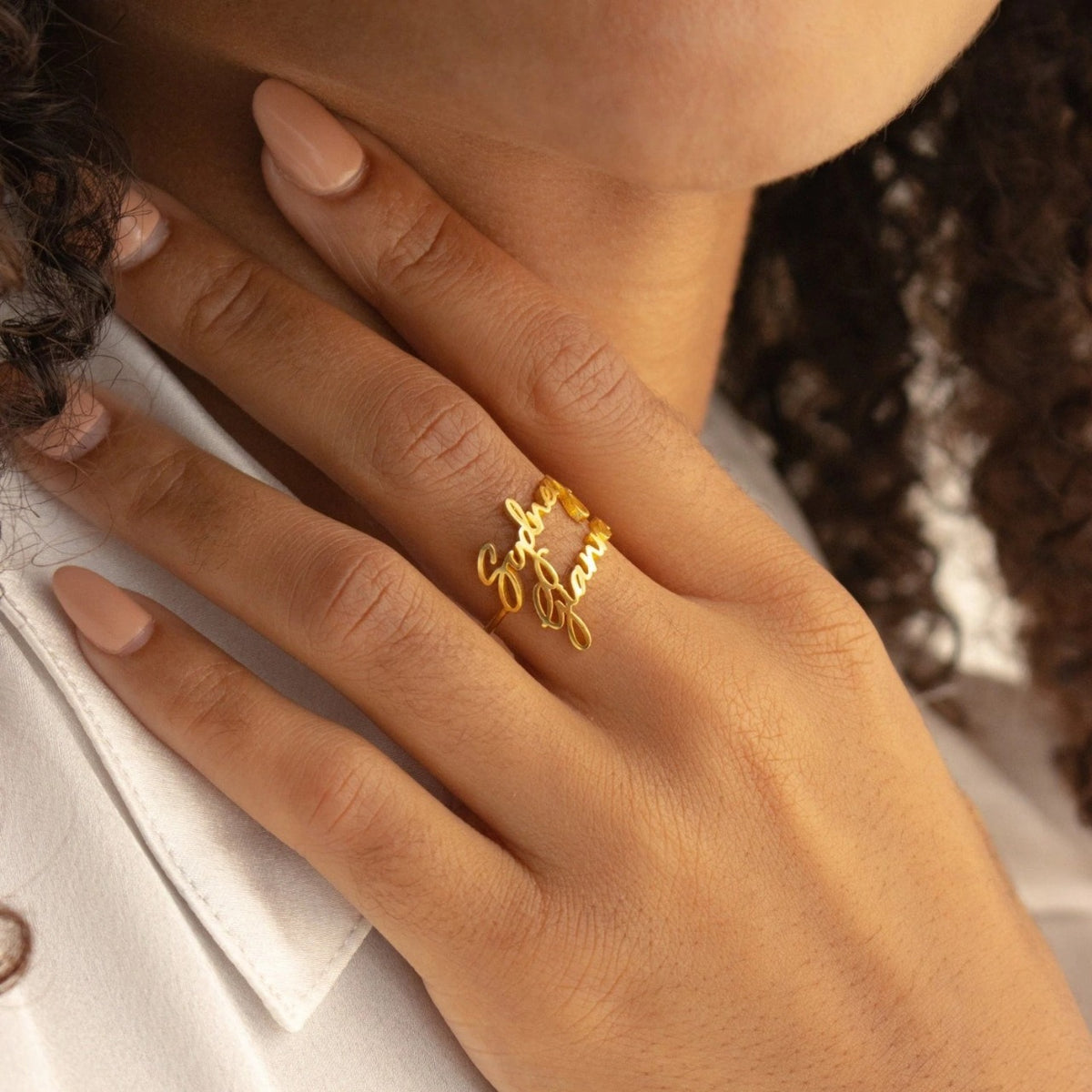 Custom duo name ring from MUHVA STORE with engraved personalized names on a sleek silver band.