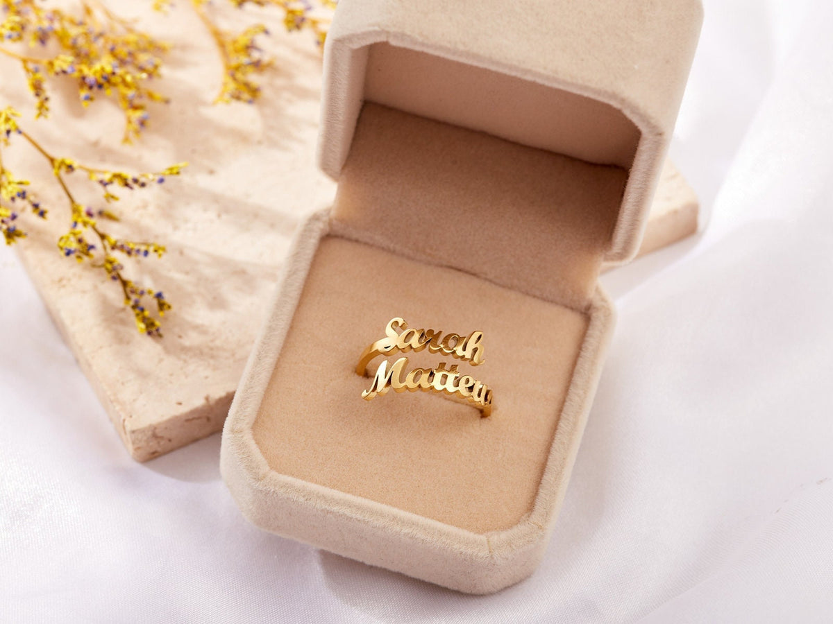 Custom duo name ring from MUHVA STORE featuring personalized engraved names on a sleek silver band.