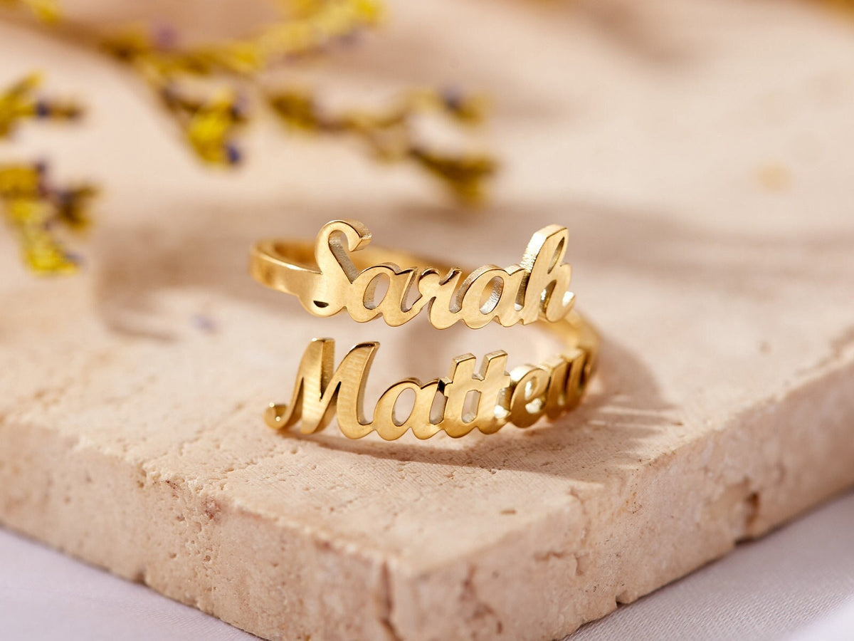 Custom duo name ring by MUHVA STORE featuring two engraved names on a sleek silver band.