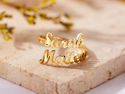 Custom duo name ring by MUHVA STORE featuring two engraved names on a sleek silver band.