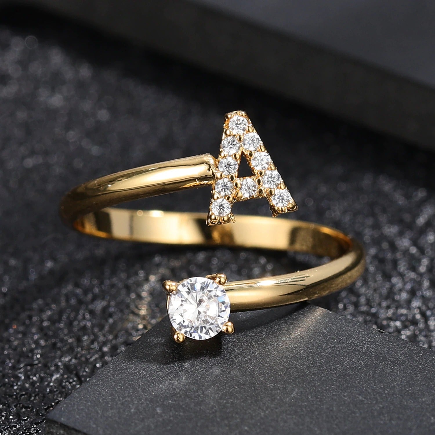 Gold diamond letter ring from MUHVA STORE featuring a sparkling diamond-embellished letter design.